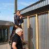 Super Don and Al raising the Mural